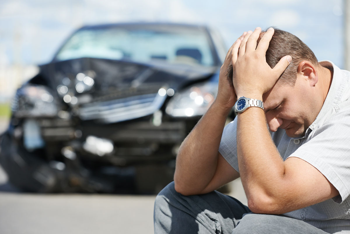 a man after an accident that needs the Cheapest Car Insurance in Norman, OK, Oklahoma City, Moore, OK, Midwest City, Shawnee, OK