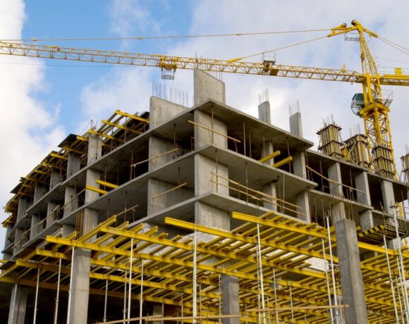 Crane Near a Construction Building with Contractors Insurance in Edmond, OK